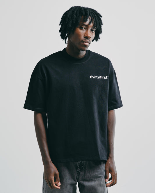 Men’s black heavyweight graphic t-shirt, relaxed fit with bold front chest print.